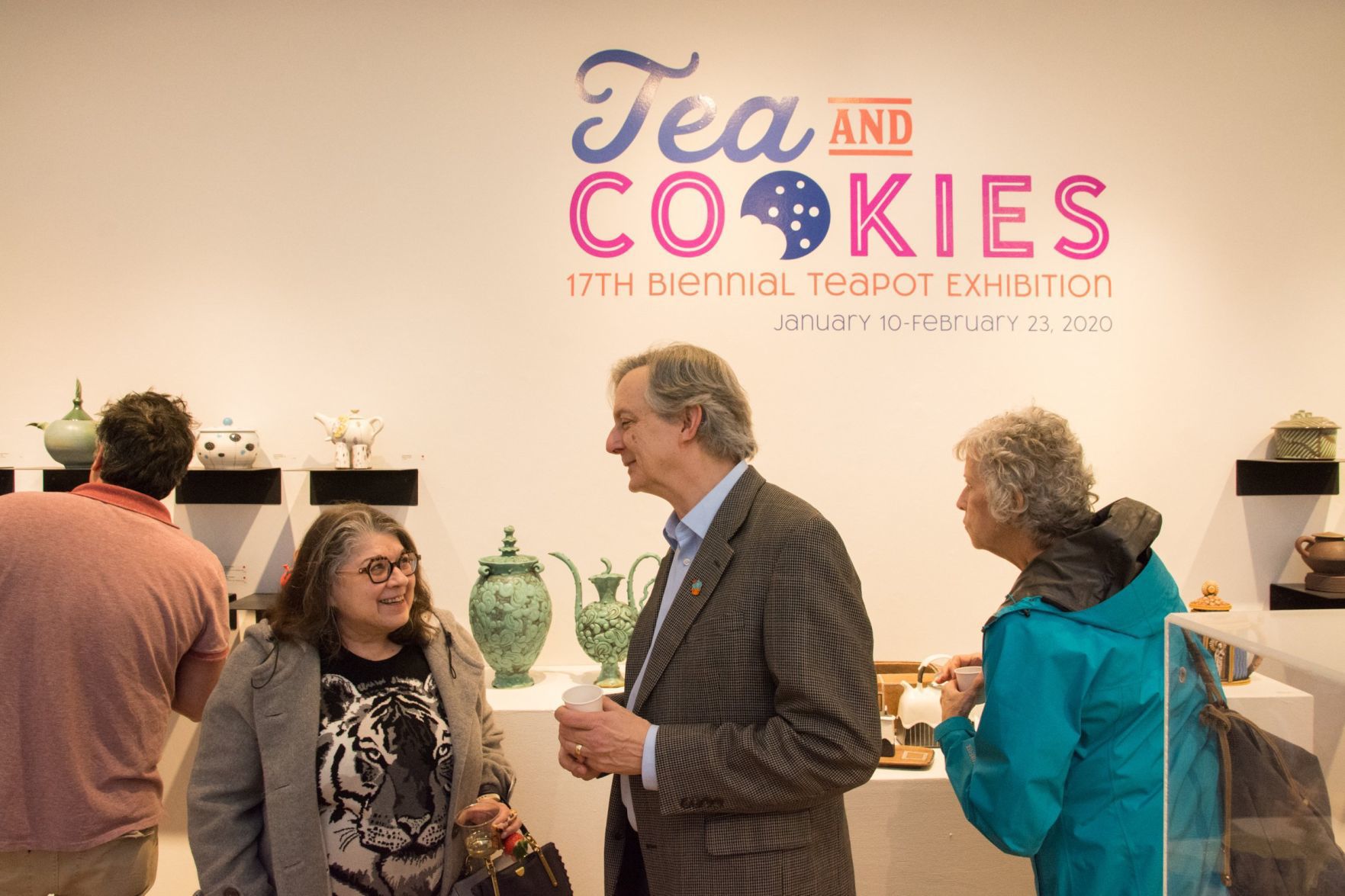 Guests mingle and chat with staff and artists